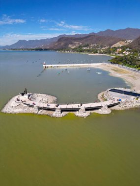 Vertical view taken with a drone of Lake Chapala where you can see the lighthouse and the monument of Christ the Fisherman, Mexico clipart