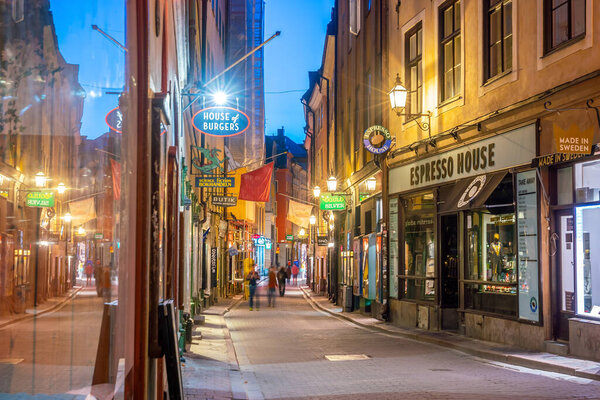 STOCKHOLM, SWEDEN - MAY 7, 2018 : Shopping street of Gamla Stan in old town centre of Stockholm, Sweden at night