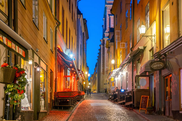 STOCKHOLM, SWEDEN - MAY 7, 2018 : Shopping street of Gamla Stan in old town centre of Stockholm, Sweden at night