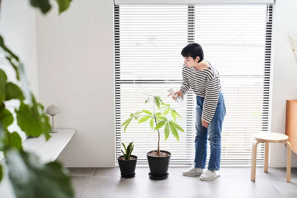 Young Woman Taking Care Houseplants Room — Stock Photo, Image