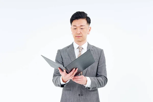 Man Suit Looking Documents White Background — Stockfoto
