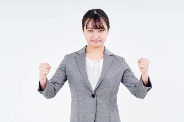 A woman in a suit who is stressed and white background