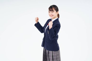 A high school girl cheering and white background