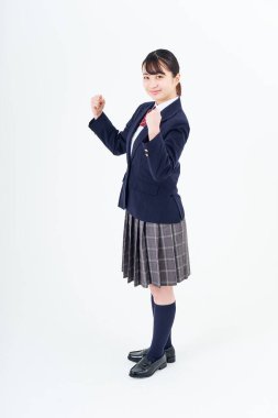 A high school girl cheering and white background