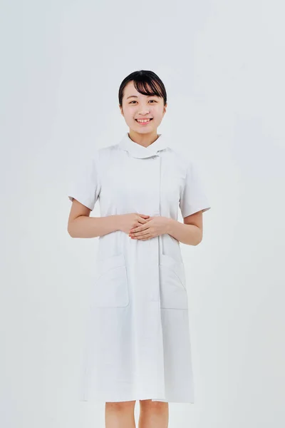 Young Woman Wearing White Coat Indoors White Background — Foto de Stock