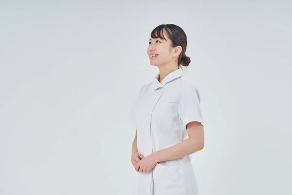 Young Woman Wearing White Coat Indoors White Background — Stock Photo, Image