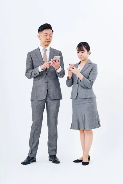 Man Woman Suits Smartphones White Background — Fotografia de Stock