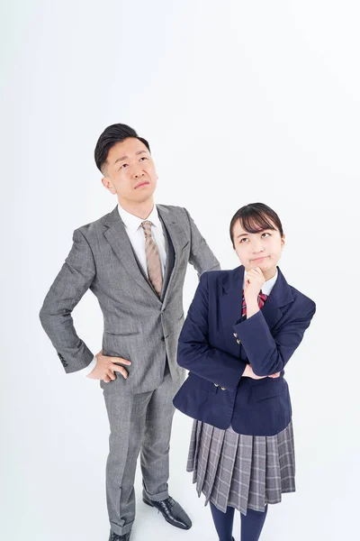 Man High School Girl Suit Uneasy Expression White Background — Stockfoto