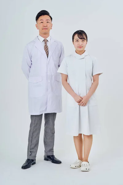Man and woman in white coats  and white background