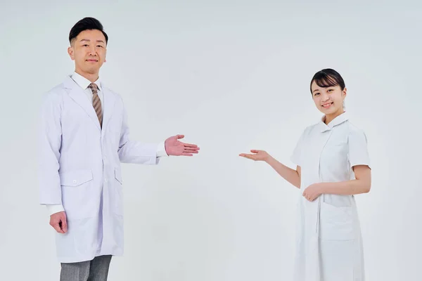 Man and woman in white coats  and white background