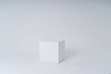 A white box in a white room