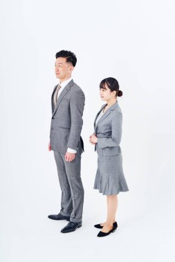 man and woman in suits and white background