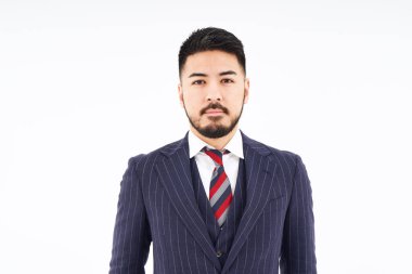 portrait of man in suit and white background