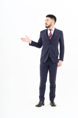 A man in a suit posing for guidance and white background