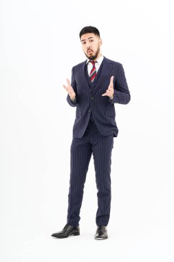 A man in a suit posing in thought and white background