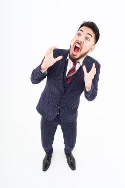 A man in a suit with a surprised expression and white background