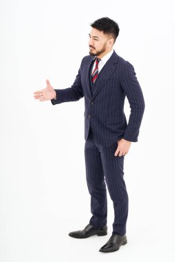 A man in a suit asking for a handshake and white background
