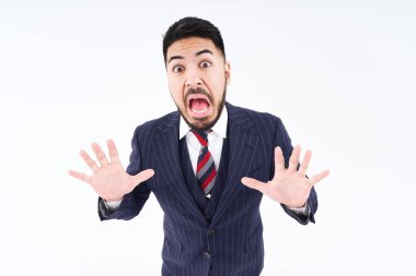 A man in a suit with a surprised expression and white background