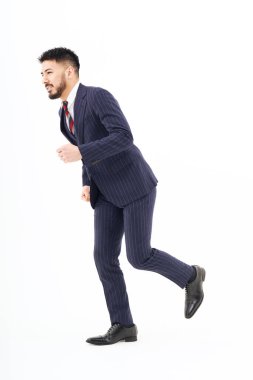 A man in a suit doing a running pose and white background