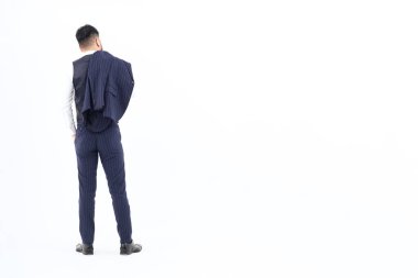 A man in a suit taking off his jacket and white background