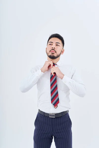 Business Man Adjusting His Tie White Background — Stock Photo, Image