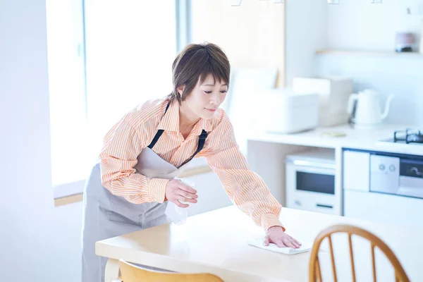 Woman Wiping Dining Table Room — Stock Photo, Image