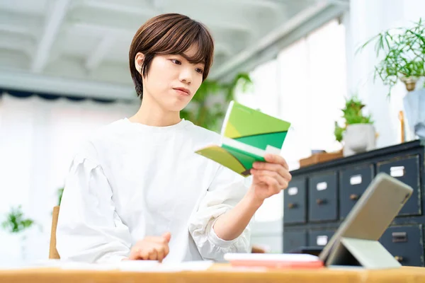 Young Woman Looking Her Bankbook Indoors — Stock Photo, Image