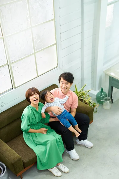 Family Three Smiling Relaxing Indoors — Stock Photo, Image