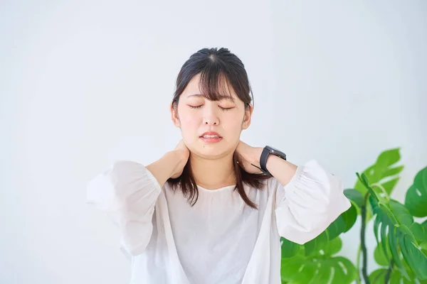 Young Woman Suffering Stiff Shoulders Indoors — Stock Photo, Image