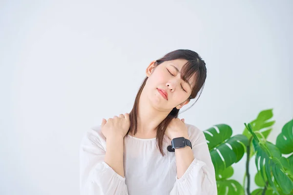 Young Woman Suffering Stiff Shoulders Indoors — Stock Photo, Image