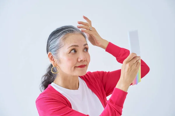 Senior Woman Looking Mirror Indoors — Stock Photo, Image