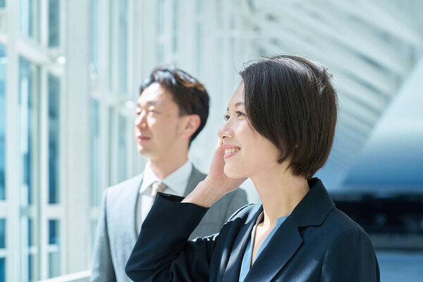 Portrait of middle-aged men and women wearing suits