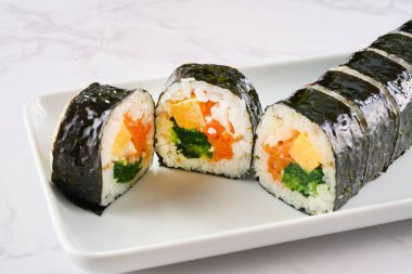 Sliced Korean style seaweed rolls clipart