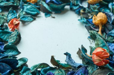 Colorful dried flowers with a predominantly blue color placed on a table