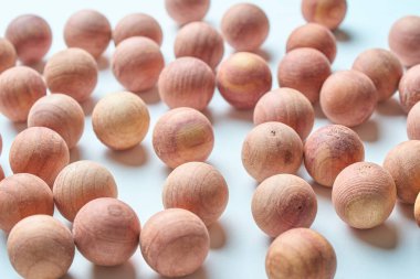 A wooden sphere filling the screen on a table