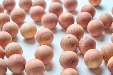 A wooden sphere filling the screen on a table