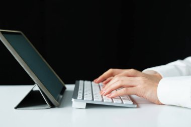 close up of hands typing on a computer keyboard clipart