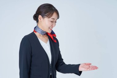 A woman in a suit posing for guidance and white background