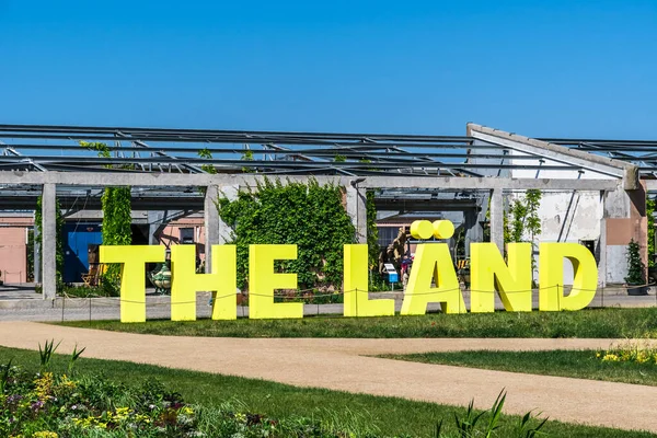 stock image Mannheim, Germany - 26.05.2023: Word The Laend in big green letters (german-english mixture for: the country) at the Bundesgartenschau (federal horticulture show) 