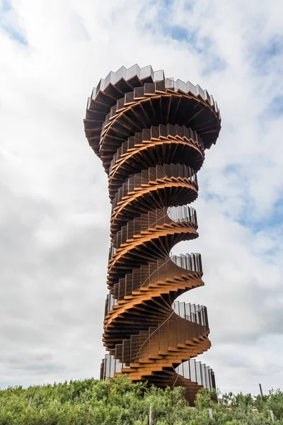 stock image Skaerbaek, Denmark - June 4, 2023: Marsk or Marsh Tower is a double helix-shaped corten steel observation tower located in the Wadden Sea National Park at Skaerbaek, Denmark with amazing view over the wadden sea.