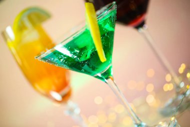 coulorful cocktails with lights in background, alcohol, cocktail, drink, bar, glass, beverage, ice, liquor, party, fresh, restaurant, lime, gin, margarita, cold, martini, mojito, vodka, lemon, club, refreshment, bartender, tropical, soda, alcoholic, 