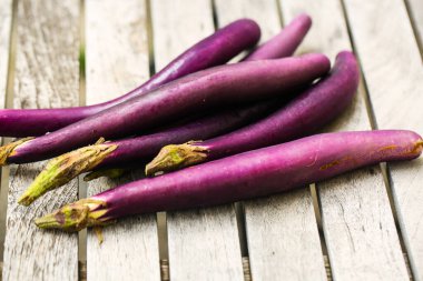 japanes Aubergine on wooden table clipart