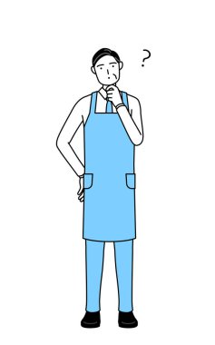 Soruları olan önlüklü kıdemli bir adam..