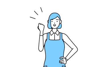 Önlüklü bir kadın cesaretle poz veriyor..