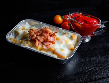 french fries with melted cheese and bacon