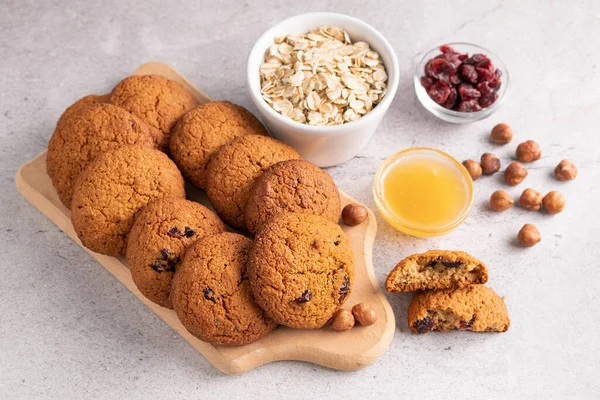 Gray Table Oatmeal Cookies Honey Hazelnuts Oatmeal Cranberries Plate Concept — Stock Photo, Image