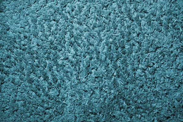 Texture of leather carpet with high pile in sea blue color