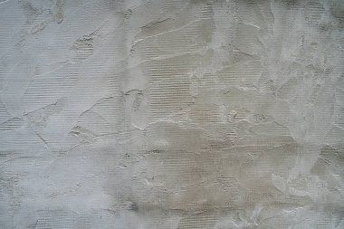 The texture of the cement wall with the joints after the trowel   