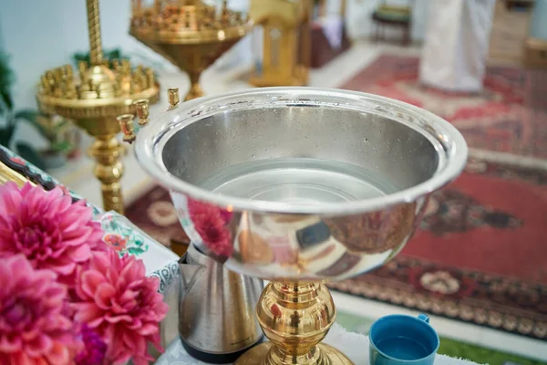 A close-up of a baptismal font in a church