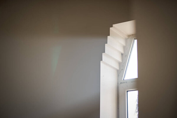 Close-up of sunlight shining through a small window in a church